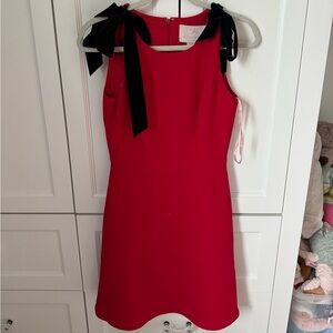 red dress with black bow ties straps. gal meets glam new with tags, size 2.